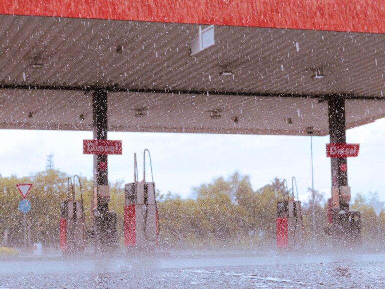 A photo of a gas station in a heavy rainfall.