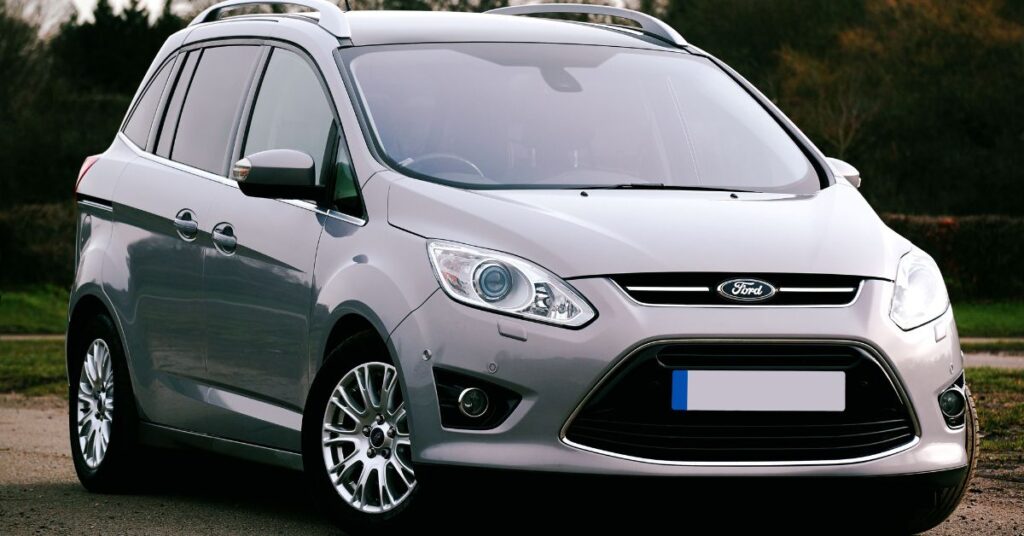 Silver Ford C-Max MPV parked outdoors, featuring a modern front grille, alloy wheels, and spacious family-friendly design.