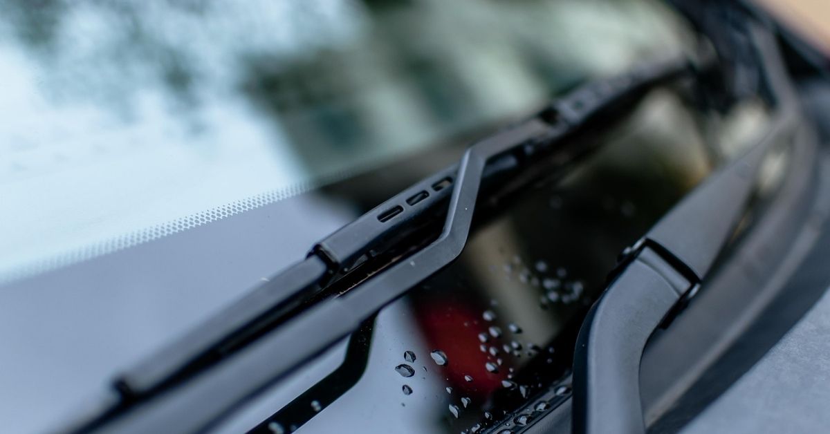 Close up photo of a car windshield wiper.